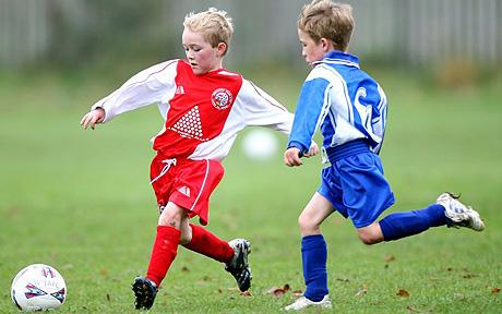 Kids playing football